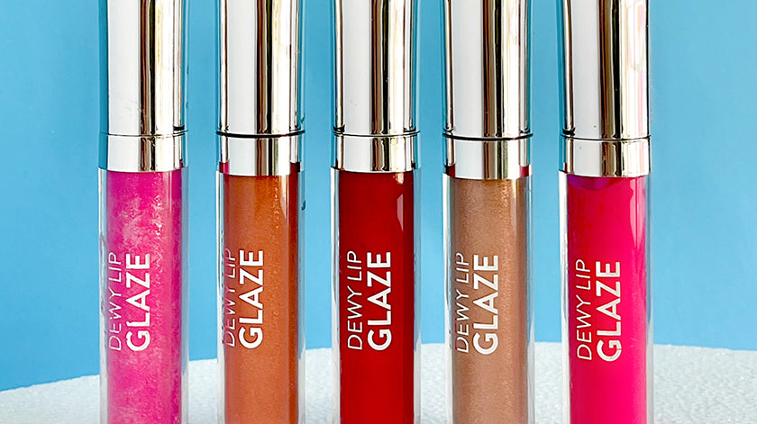 Flormar Dewy Lip Glaze collection featuring five vibrant shades, including pink, red, and nude tones, displayed against a bright blue background - Flormar Lebanon
