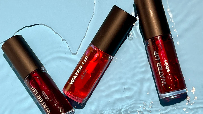 Flormar Water Lip Stain collection in vibrant red shades, displayed on a refreshing water-textured background.