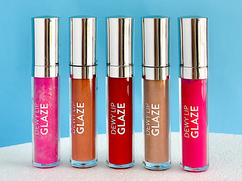 Flormar Dewy Lip Glaze collection featuring five vibrant shades, including pink, red, and nude tones, displayed against a bright blue background - Flormar Lebanon