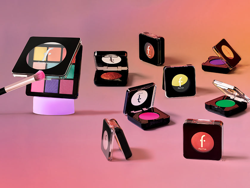 Flormar eyeshadow collection featuring vibrant palettes and single shades, available in Lebanon, displayed on a gradient pink and orange background.